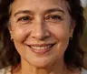 Customer review from Irene K in Seattle, Washington, featuring a close-up of a smiling woman with a natural glow, promoting Axavive anti-aging skincare results for the US wellness market.
